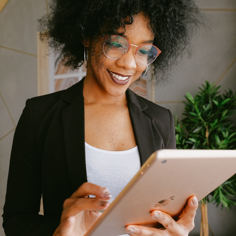 Woman reviewing a checklist on a tablet